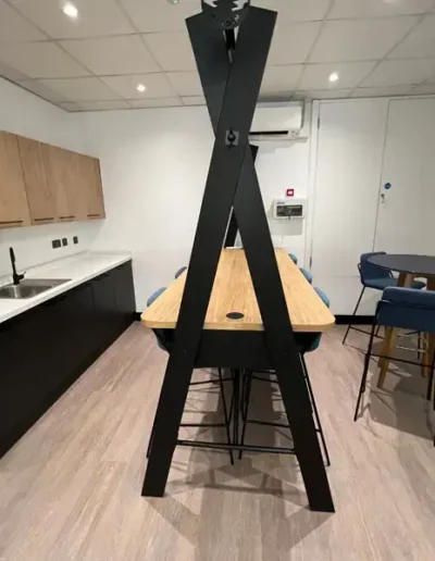 Breakout room with tables and sink